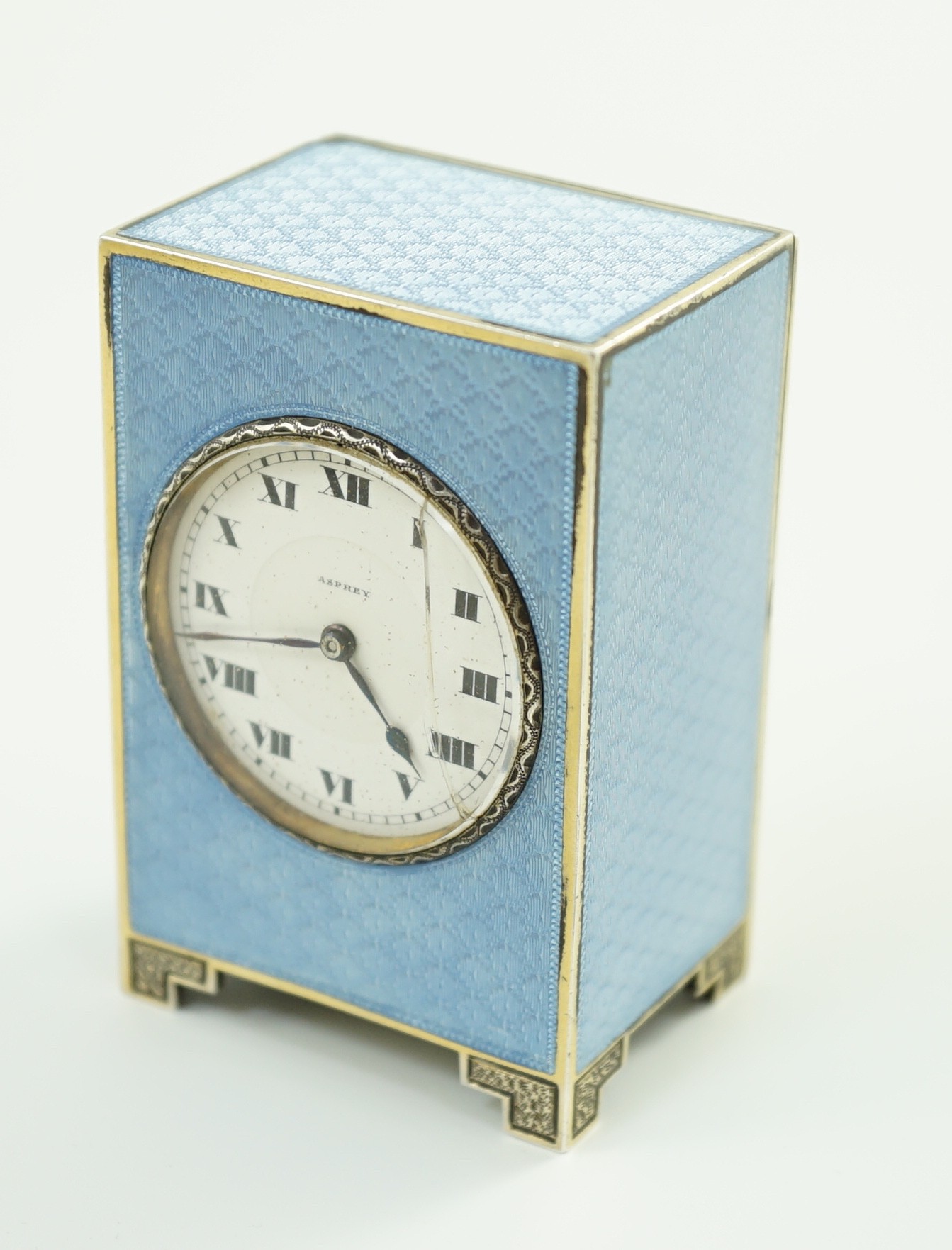 A George V continental silver and blue guilloche enamel miniature timepiece, retailed by Asprey